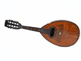 une vieille mandoline en bois posée sur un plan de travail blanc