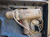a drill in a box with a cord in it