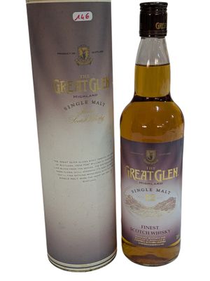 a bottle of great glen whisky next to a cardboard box