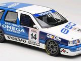 a white and blue car that is on a white surface