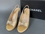 chanel shoes in box and box on table