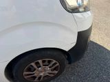a white van that is parked on the side of the road