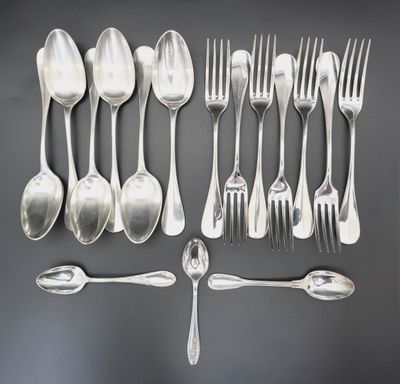 a lot of silver spoons and forks on the table
