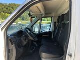 the interior of a white van with the driver ' s seat up