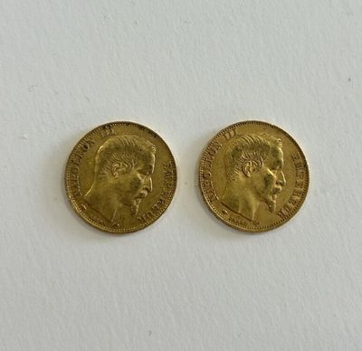 two gold sovereigns, one of which has a head of a man and one of which is a woman