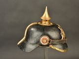 a black helmet with a gold crown on it