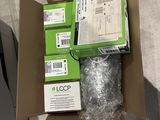 two boxes of electronic equipment in a box on the floor