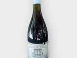 a bottle of wine that is sitting on a table