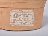 an old wooden box with a label on it