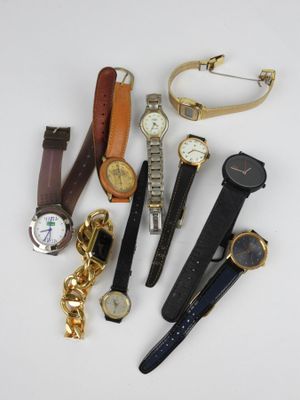 many different types of watches and watches on the table