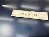 a sign that says vauto on it on a blue table