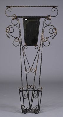 a black vase with chains around it on a stand