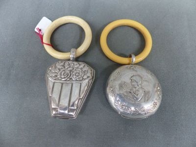 pair of silver plated and wood rings with a picture of a woman in a basket