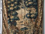 an image of a tapestry hanging on a wall in a room