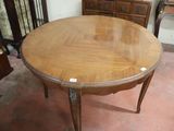 a wooden table with a glass top in a room