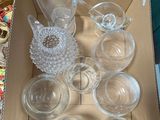 a box of empty glassware sitting on a table