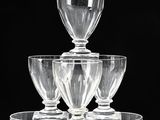 a stack of wine glasses sitting on top of each other