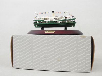 a small model of a boat on top of a box