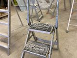 many ladders that are sitting in a room