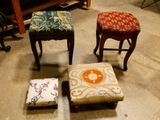 three small stools are lined up on the floor in a room