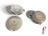 three cups and saucers sitting on a white surface