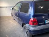 a picture of a blue car parked in a garage