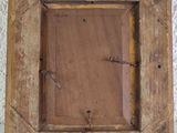 an old wooden picture frame with nails and nails on it