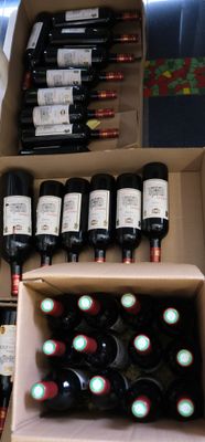 many bottles of wine in a box on the table