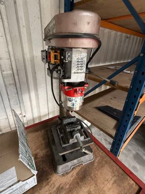 an image of a drill on a table in a warehouse
