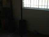 a light that is on a tripod in a dark room