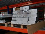 a large stack of boxes sitting on a pallet in a warehouse