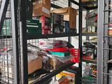 a metal rack with many items on it in a room