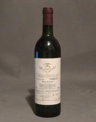 a bottle of wine that is sitting on a table