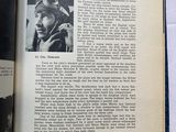 an open book with a picture of a man in a military uniform