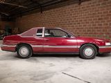 a red car that is parked in a garage