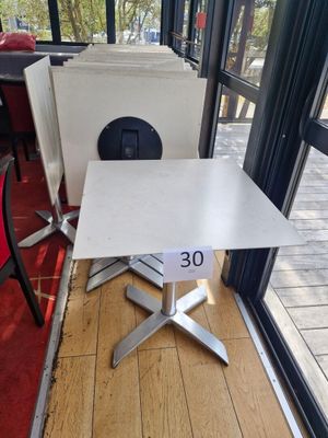 a table with a number 30 on it in front of a window