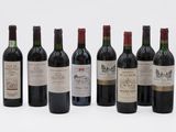 six bottles of wine are lined up in a row on a white surface