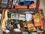a box full of assorted items sitting on the floor