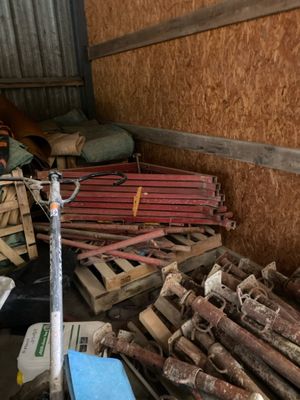 a pile of wood and other items in a storage area