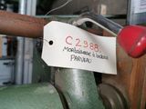 a label on the handle of a machine that has a price tag attached to it