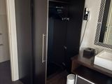 a bathroom with a sink and a mirror in it