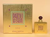 the perfume bottle is next to the box on the table