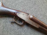 an old gun that is laying on the ground