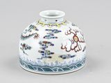 a chinese vase with a dragon design on it