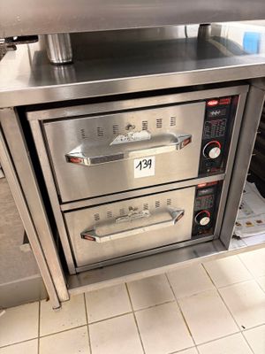 two ovens that are sitting in a kitchen