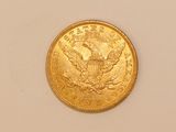 an image of a gold coin on a white surface