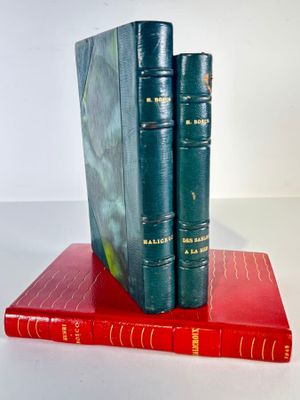 two books sitting on top of each other on a table