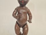 a statue of a baby that is standing on a pedestal