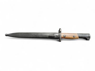 a close up of a knife with a wooden handle on a white background