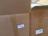 many boxes that are stacked on top of each other in a warehouse